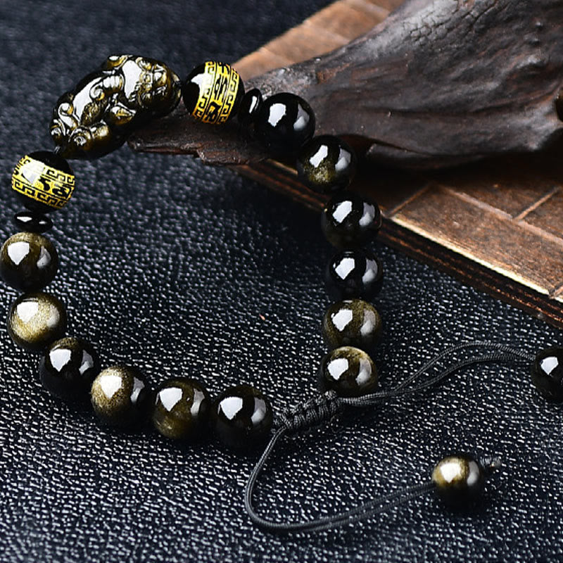 Gold Sheen Obsidian PiXiu Bracelet – Close-up of PiXiu charm and gold beads on black leather