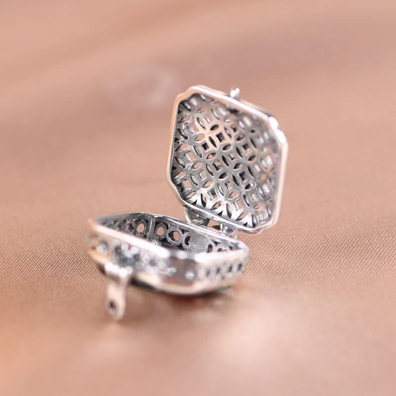 Koi Fish Lotus Ghau Prayer Box Necklace – open filigree locket interior on taupe linen, octagonal quatrefoil lattice