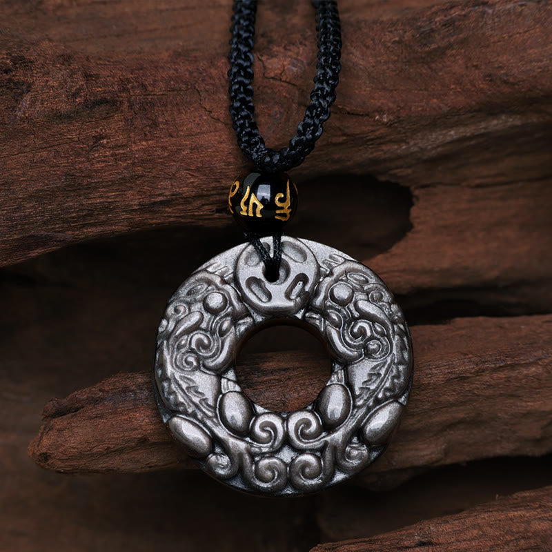 Silver Sheen Obsidian Double PiXiu Necklace – Carved obsidian disc with double PiXiu on black cord, protection jewelry