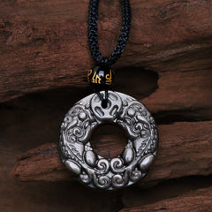 Silver Sheen Obsidian Double PiXiu Necklace – Carved obsidian disc with double PiXiu on black cord, protection jewelry