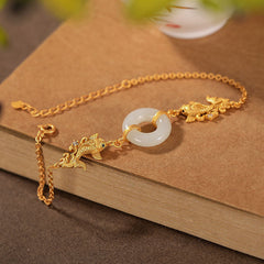 White Jade Koi Bracelet – close-up of single carved koi fish bead with detailed fin and tail texture