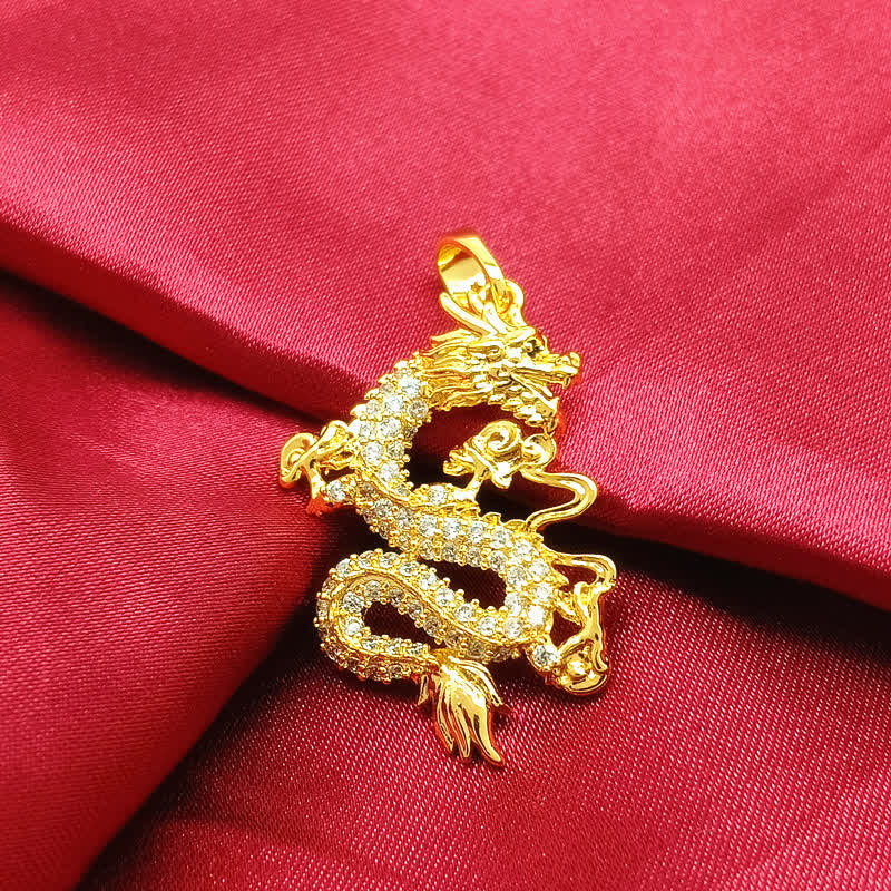 Gold Dragon Protection Necklace – Coiled dragon charm on rich red fabric, gold sculptural detail, Power