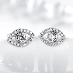 Sterling Silver Evil Eye Stud Earrings on Reflective White Surface, Clear Crystal Eye Design