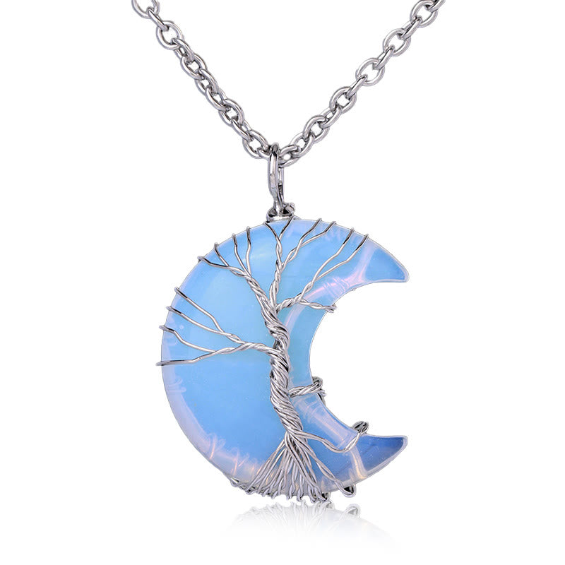 Quartz Crystal Moon Tree of Life Pendant – opalite blue-lavender crescent with silver wire tree on white, iridescent