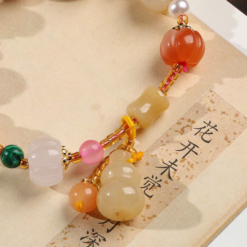Golden Silk Jade Gourd Bracelet – Close-up jade pumpkin beads, gourd on calligraphy