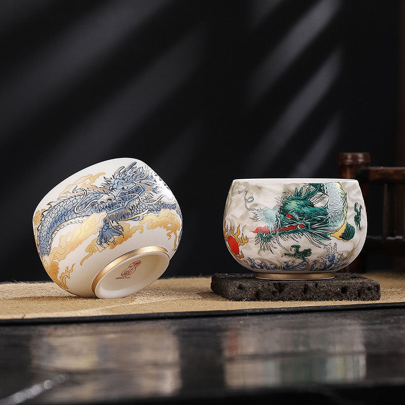 Dragon Cicada Ceramic Tea Bowl - blue-gold and green-red dragon bowls side by side, gold-rimmed foot and maker seal visible
