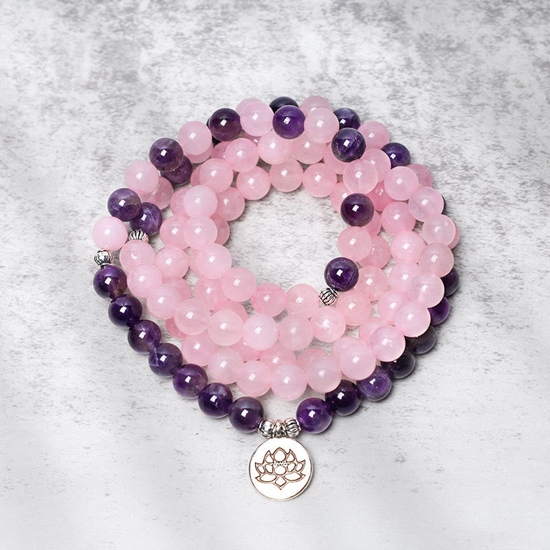 Rose Quartz Amethyst Lotus Bracelet – wrapped mala beads with silver lotus pendant, coiled flatlay