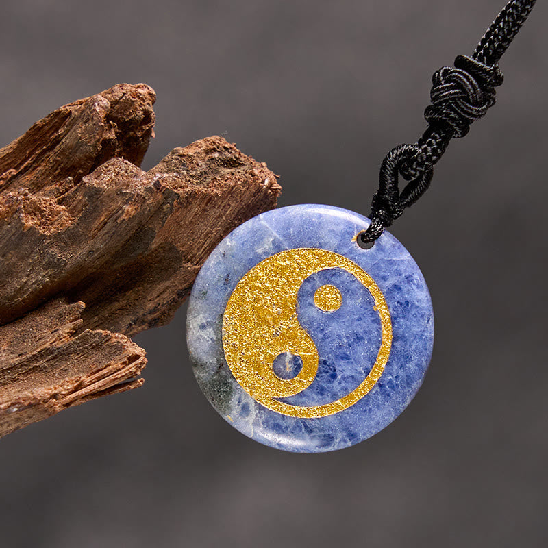 Yin Yang Crystal Necklace – Blue sodalite pendant with gold yin-yang inlay, natural stone with white marbling, polished finis