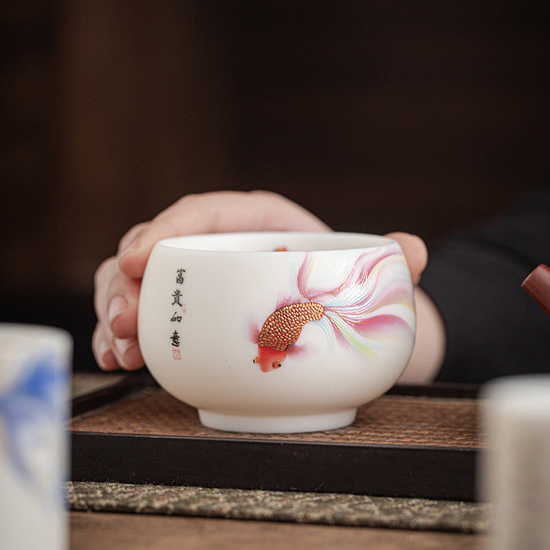 Koi Fish Ceramic Cup - close-up of lotus flower accent beside koi fish, zen tea ware