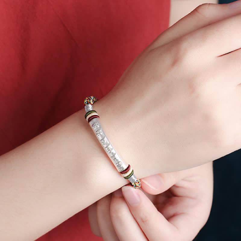 Om Mani Padme Hum Red String Bracelet – Multi-color cord with silver mantra tube worn on wrist