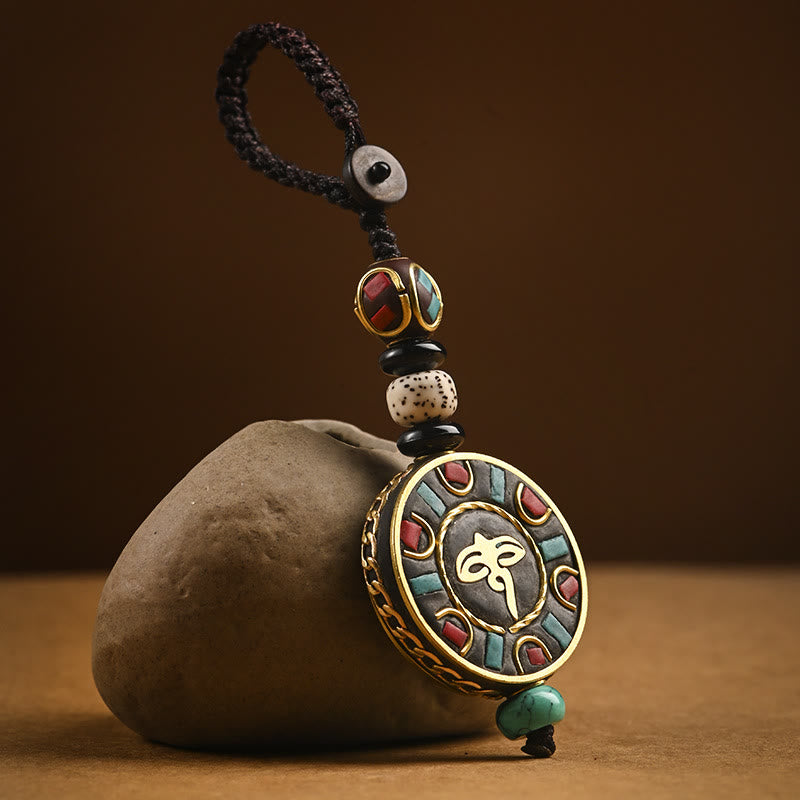 Tibetan Bodhi Seed Peace Key Chain – Flat-lay Om medallion with turquoise inlay and beaded cord, Tibetan amulet