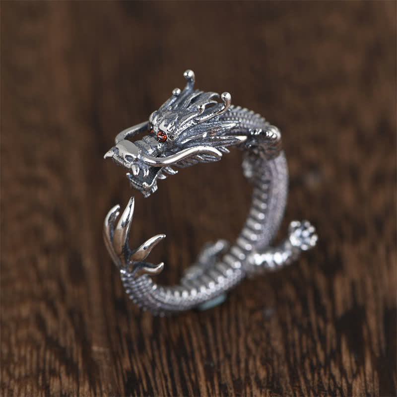 925 Sterling Silver Dragon Ring – Sculpted dragon head with red gemstone eyes on dark wood, Bold