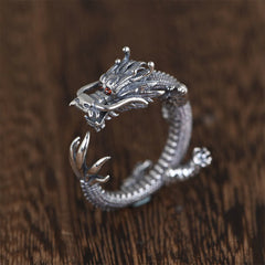 925 Sterling Silver Dragon Ring – Sculpted dragon head with red gemstone eyes on dark wood, Bold