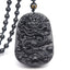 Black Obsidian Dragon Pendant – Front-facing relief dragon on white studio backdrop, protective