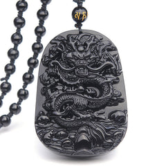 Black Obsidian Dragon Pendant – Front-facing relief dragon on white studio backdrop, protective