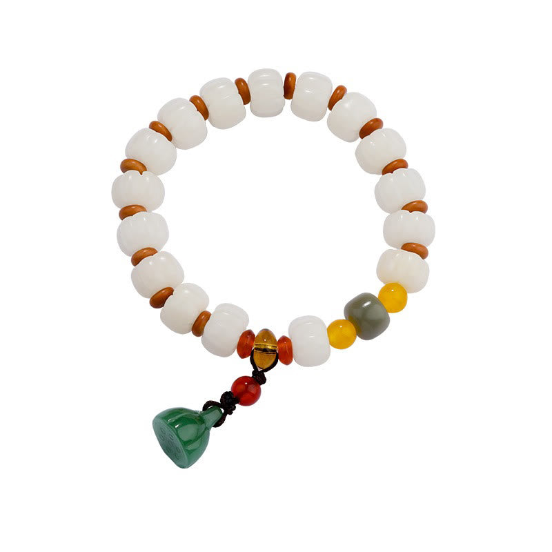 Bodhi Seed Lotus Bead Bracelet - white beads with gold center bead, clean studio shot