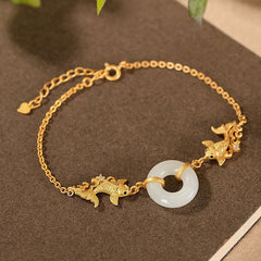 White Jade Koi Bracelet – full bracelet laid flat showing all white jade koi fish beads on elastic cord