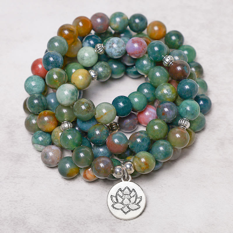 108 Mala Indian Agate Bracelet – coiled agate beads with silver Lotus charm on light surface, meditation prayer beads
