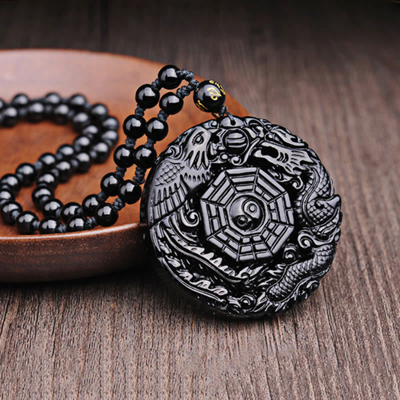 Bagua Dragon Phoenix Obsidian Pendant – Dragon-phoenix relief on wood with bowl prop, traditional