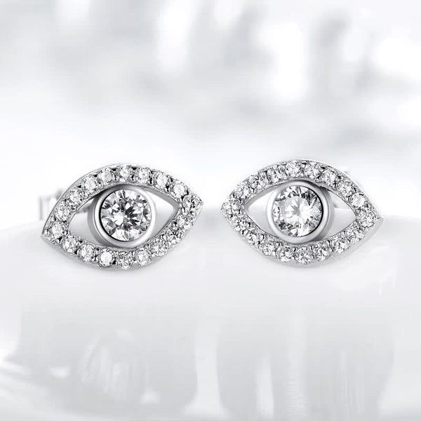Evil Eye Bundle – Silver pavé evil eye stud earrings on soft white background, crystal sparkle detail