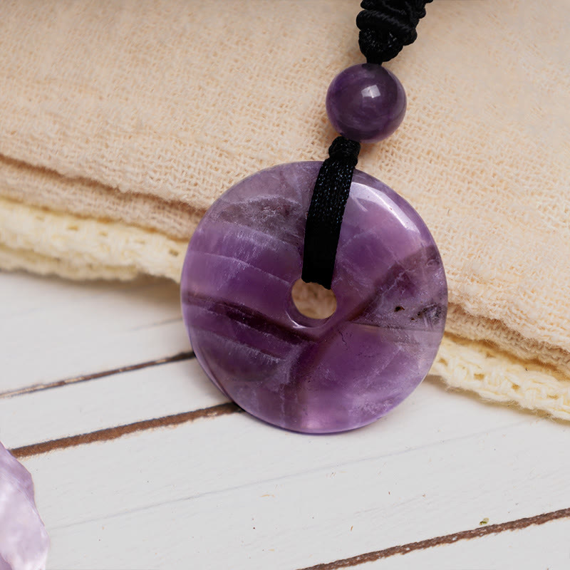 Lucky Coin Pendant Healing Crystal Gemstone Necklace – Purple amethyst donut pendant with natural banding on black cord