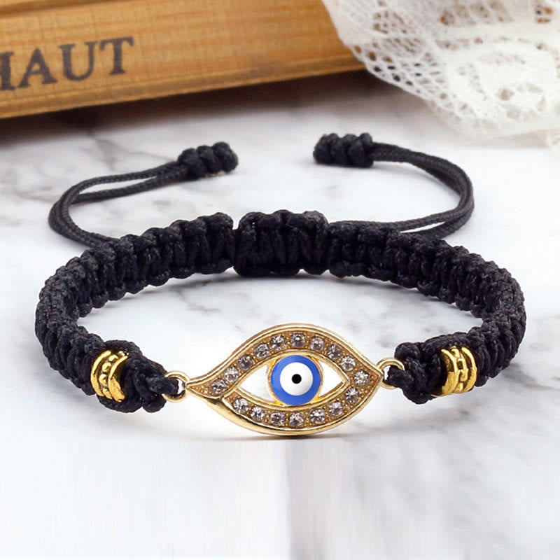 Black cord evil eye bracelet with gold blue evil eye crystal charm, marble styling
