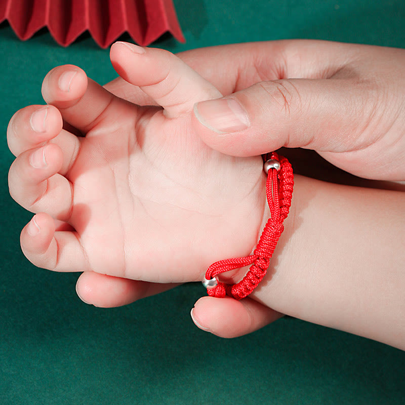 999 Sterling Silver Zodiac Red Rope Kids Bracelet - Tiger charm on red cord on child wrist with adult, cultural gift