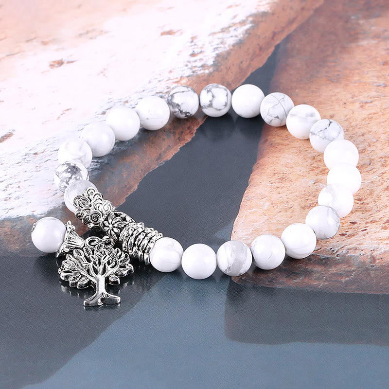 Tree of Life howlite bracelet with white gray-veined beads, antique silver Tree of Life charm, decorative silver metal spacer beads.