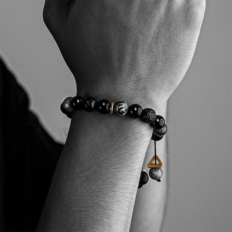 Black Obsidian Lava Rock Yin Yang Bracelet – Beaded bracelet on man’s wrist with gold charm, masculine healing stone jewelry