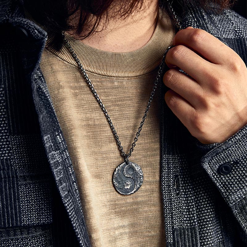 Sterling Silver Yin Yang Necklace – On-model lifestyle shot, textured pendant with plaid shirt layering