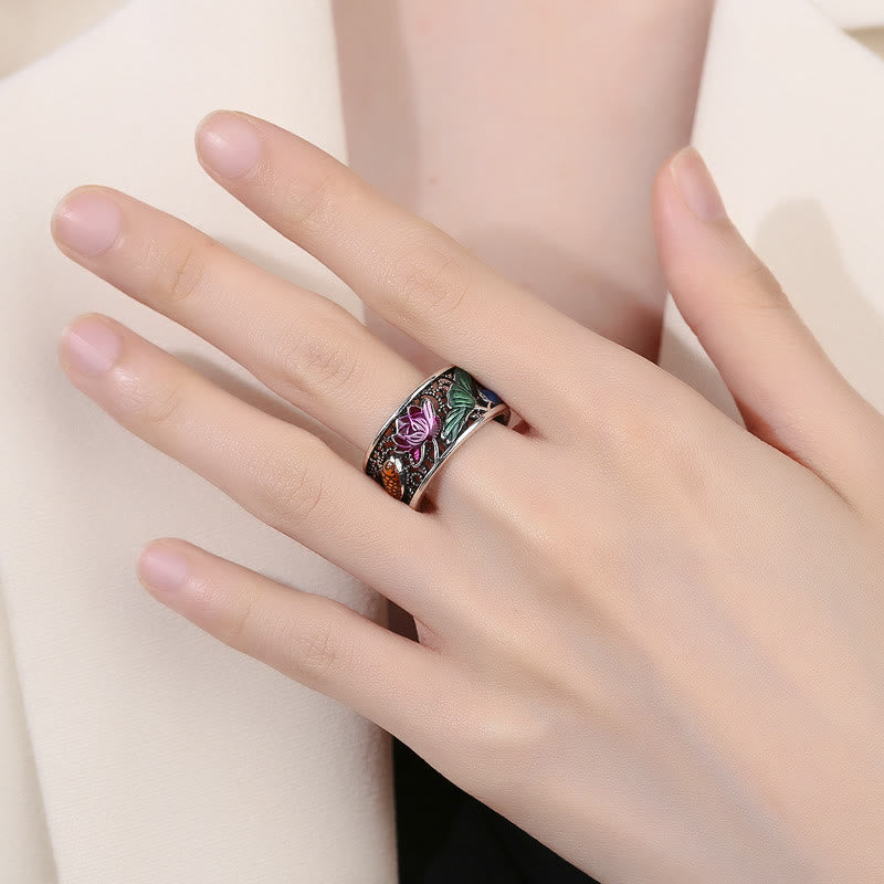 Copper Enamel Koi Fish Ring – lifestyle shot on hand holding traditional Chinese teacup