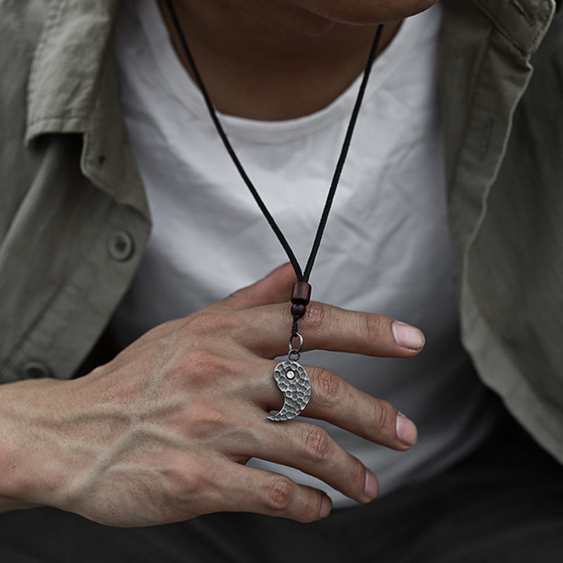 Sterling Silver Yin Yang Pendant - Polished silver pendant touched by hand on model, men artisan necklace lifestyle