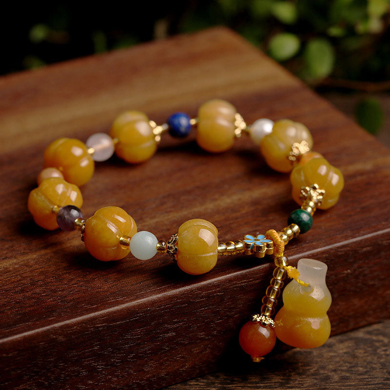 Golden Silk Jade Bracelet – yellow pumpkin beads Pixiu charm wood, wealth feng shui jewelry