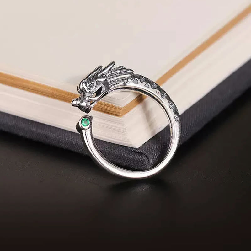 Vintage Dragon Design Ring - Silver dragon wrap ring with green gem accent on vintage book, Success