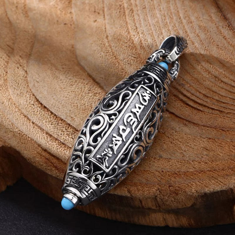 Nine-Eye Dzi Bead Pendant - Oxidized silver with Tibetan script panel and turquoise terminals