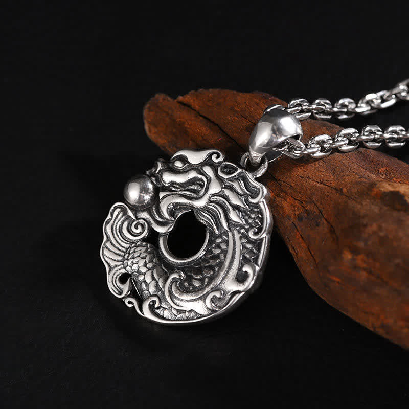 Dragon Koi Luck Necklace - natural light lifestyle shot on fabric background, amulet