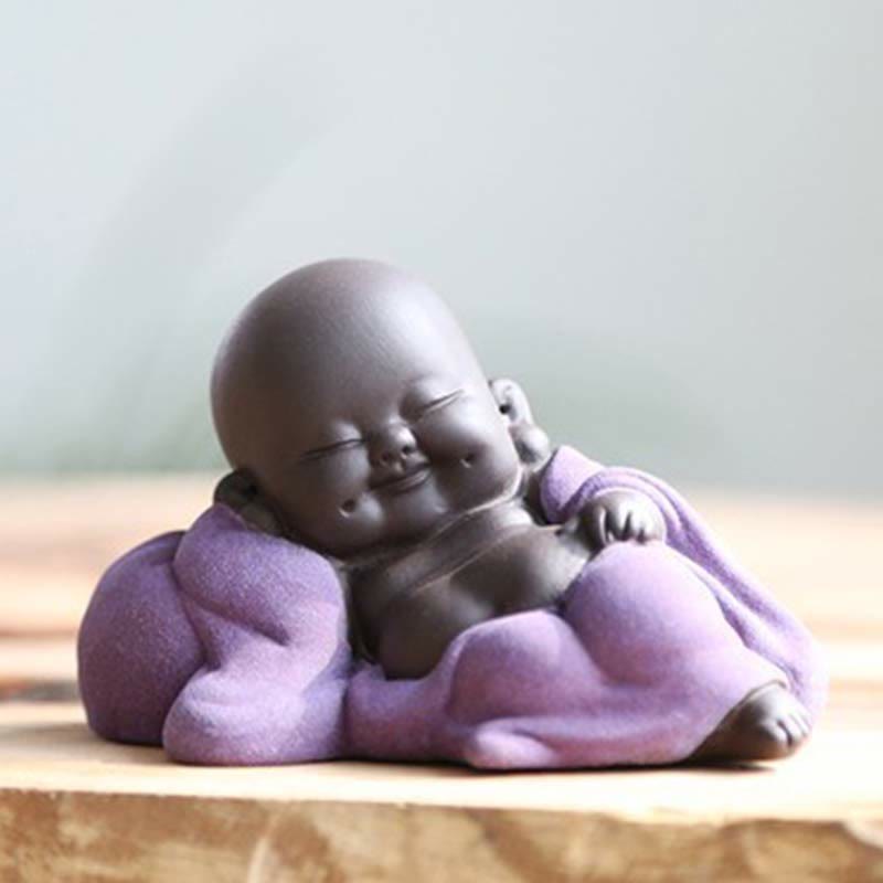 Laughing Buddha Purple Clay Maitreya Statue – straight-on view with lavender purple robe, dimpled cheeks and spread fingers, pure white background studio shot