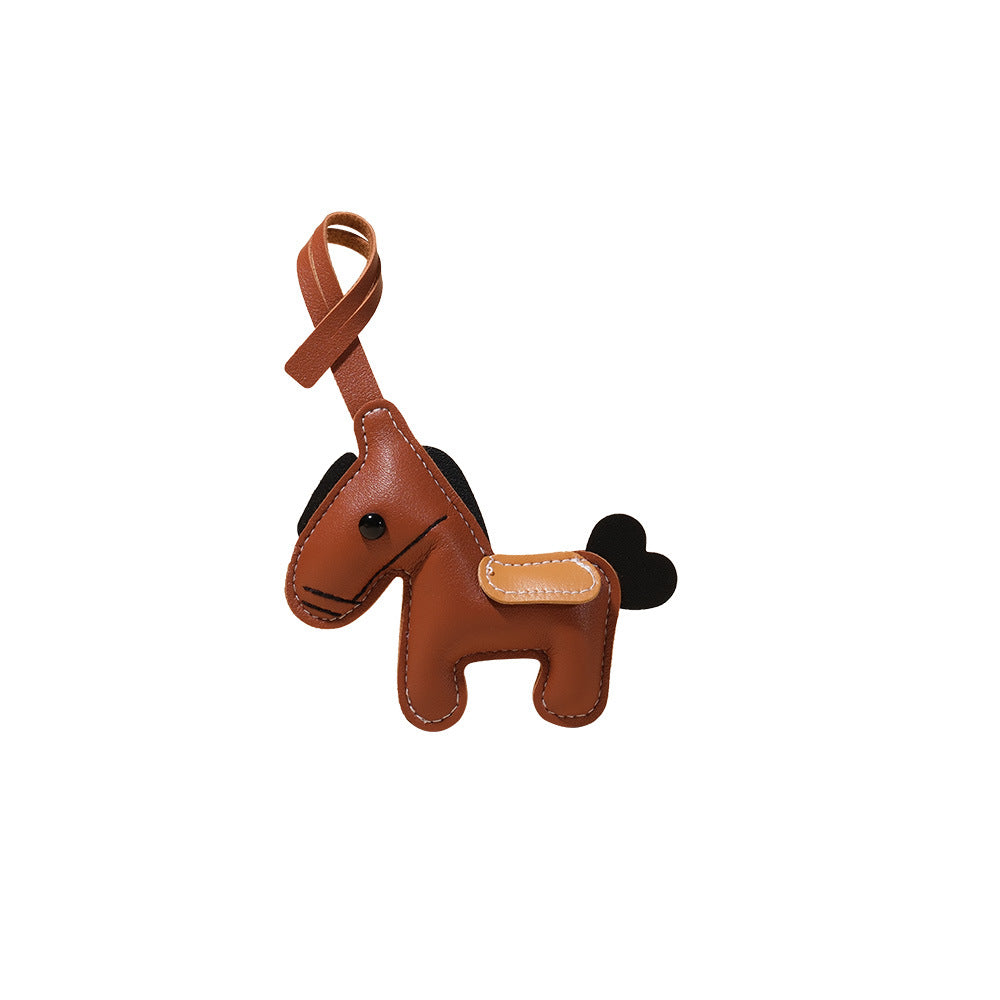 Feng Shui Leather Horse Keychain – Brown PU leather horse isolated on white background, gift keychain
