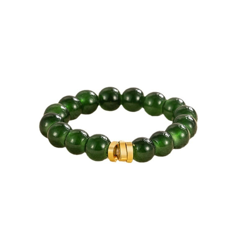 Jade Bead Ring – deep green jade bead ring isolated on white, polished stones with gold accent, classic minimalist feng shui band
