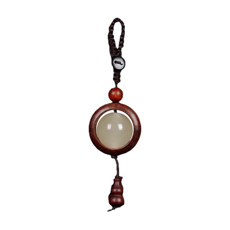 Feng Shui Sandalwood Keychain with Luminous Bead – White background product shot of Green Sandalwood version with luminous center