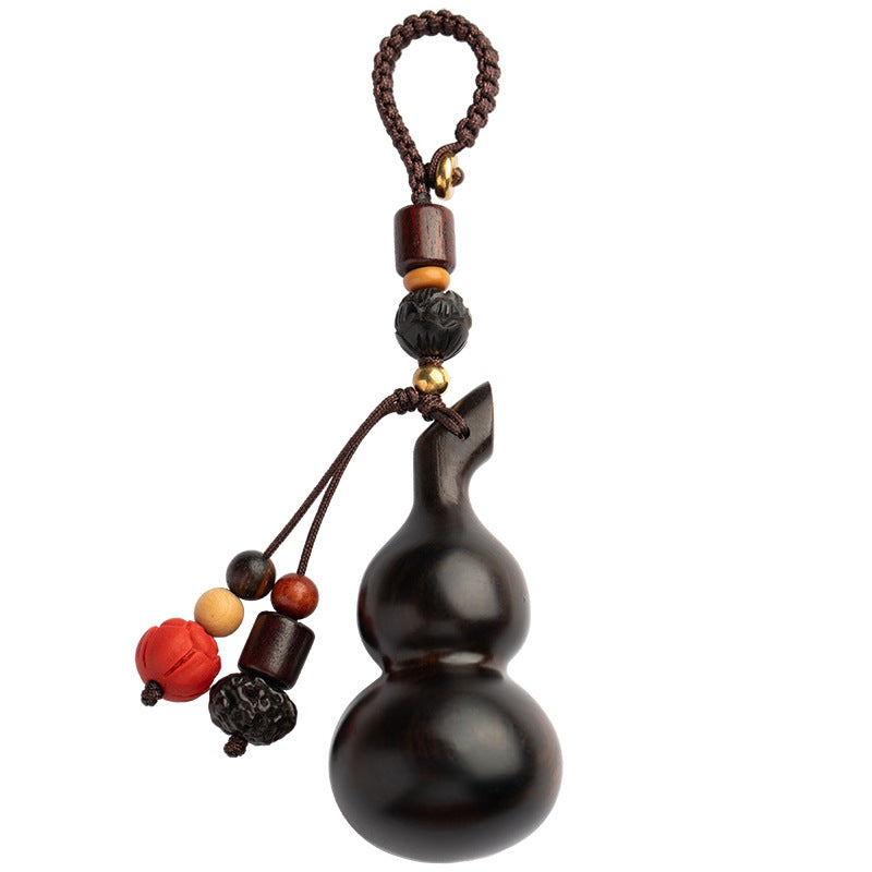 Sandalwood Gourd Keychain – single dark gourd on white background showing braided cord detail