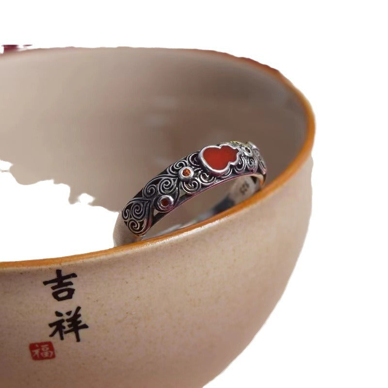 Jade Gourd Ring – red agate variant resting on ceramic bowl edge with Chinese calligraphy, cloud carved silver band, health and luck accessory