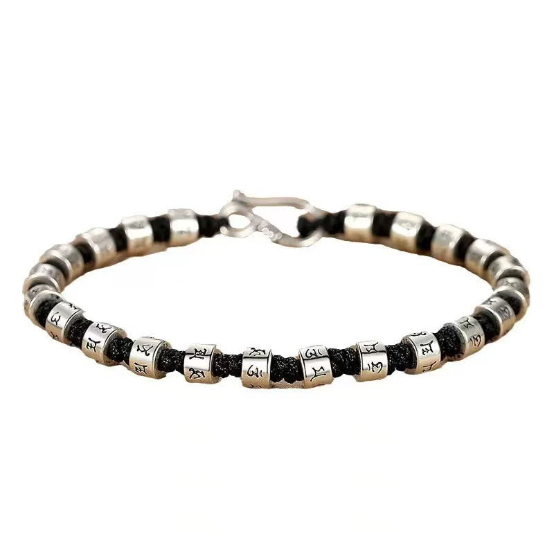 Zen Mantra Cord Bracelet – full product shot of engraved silver bead bracelet on black woven rope, white background, zen spiritual jewelry