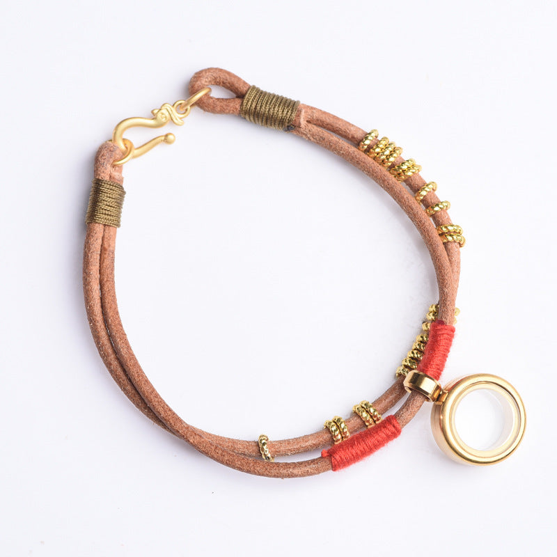 Gau Box Bracelet – isolated white background showing gold S-hook clasp and circular gau pendant, detailed view