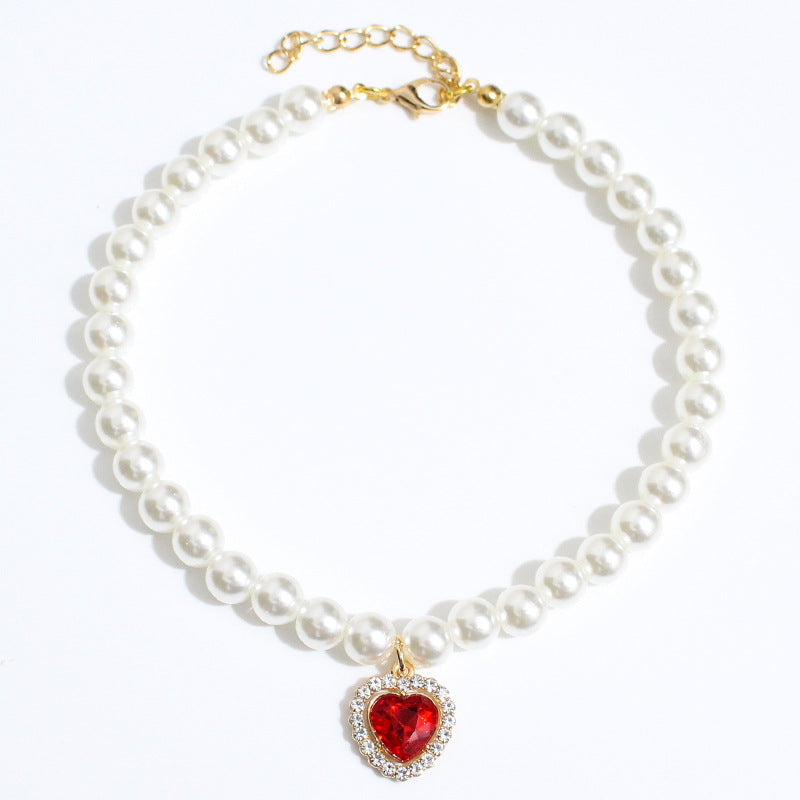 Crystal Heart Pet Necklace – Red heart crystal pearl collar on white background with gold chain clasp