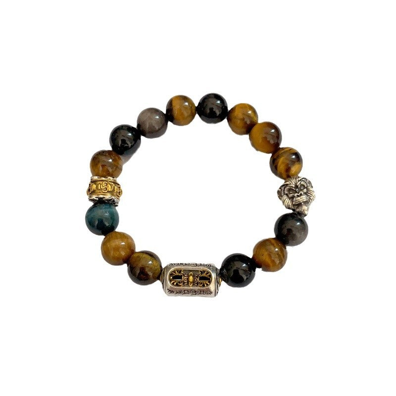Tiger Eye Bracelet – Isolated tiger eye and black stone bracelet with lion charm on white, spiritual wealth gift