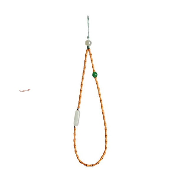 Olive Kernel Phone Chain – single bamboo bead strand with jade bar and green bead on white, minimalist phone strap