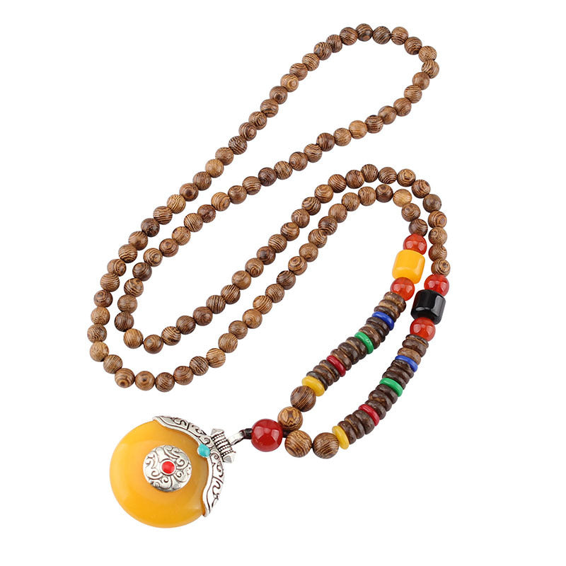 Wenge Mala Necklace – 108 beads with yellow donut pendant silver filigree detail white background, yoga gift
