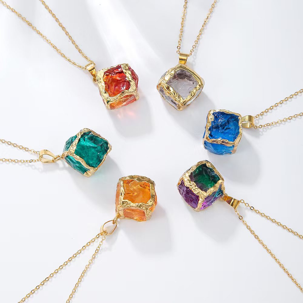 Gemstone Chip Pendant – Five gemstone cube pendants flat lay on white surface, gold chain natural crystal necklace