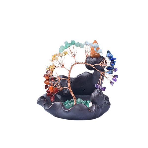 Rainbow Crystal Money Tree – dark lotus burner with orange incense cone, white background, prosperity meditation piece